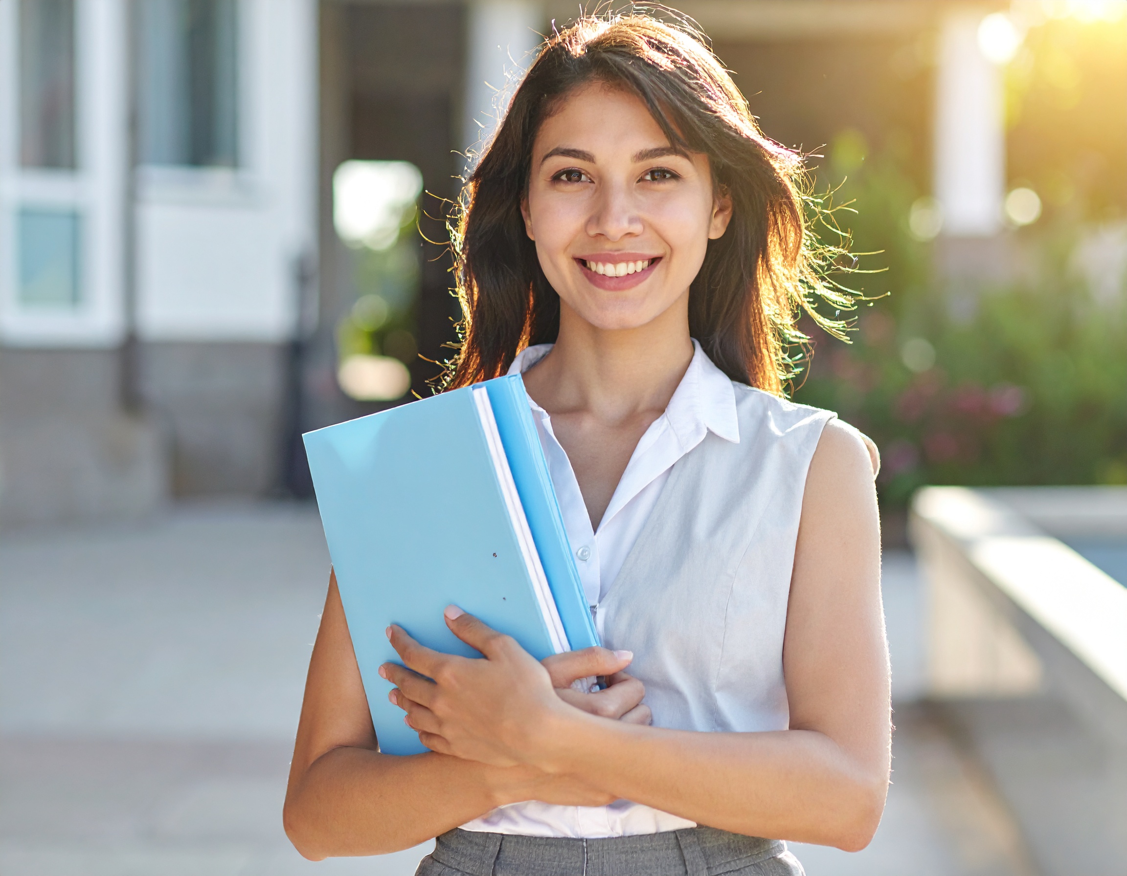 firefly create a image of girl stand with some papers in formal dress with happy face locatio 286336